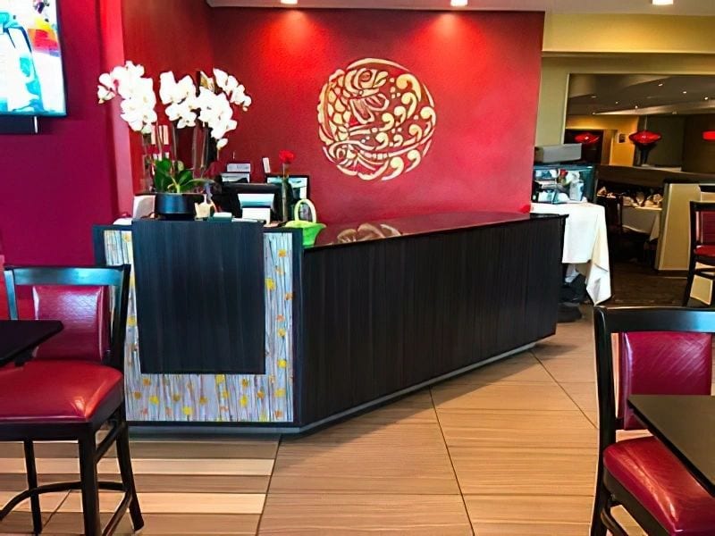 restaurant reception area with red motif and fish décor