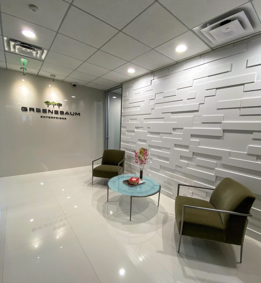 reception area with two chairs and a textured wall