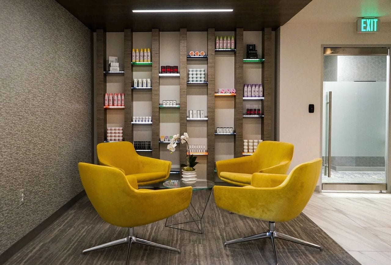 office lounge with four yellow chairs