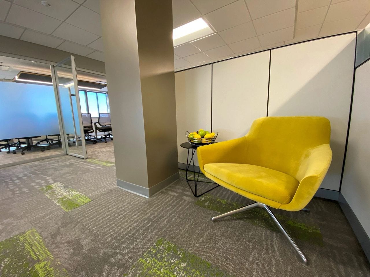 office cubicle with large yellow chair