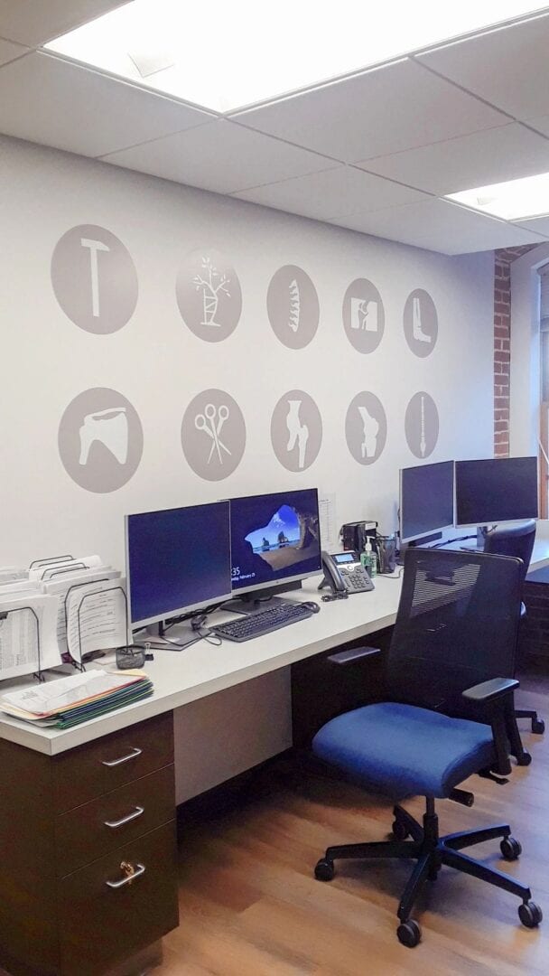 office desks with medical symbols on the wall