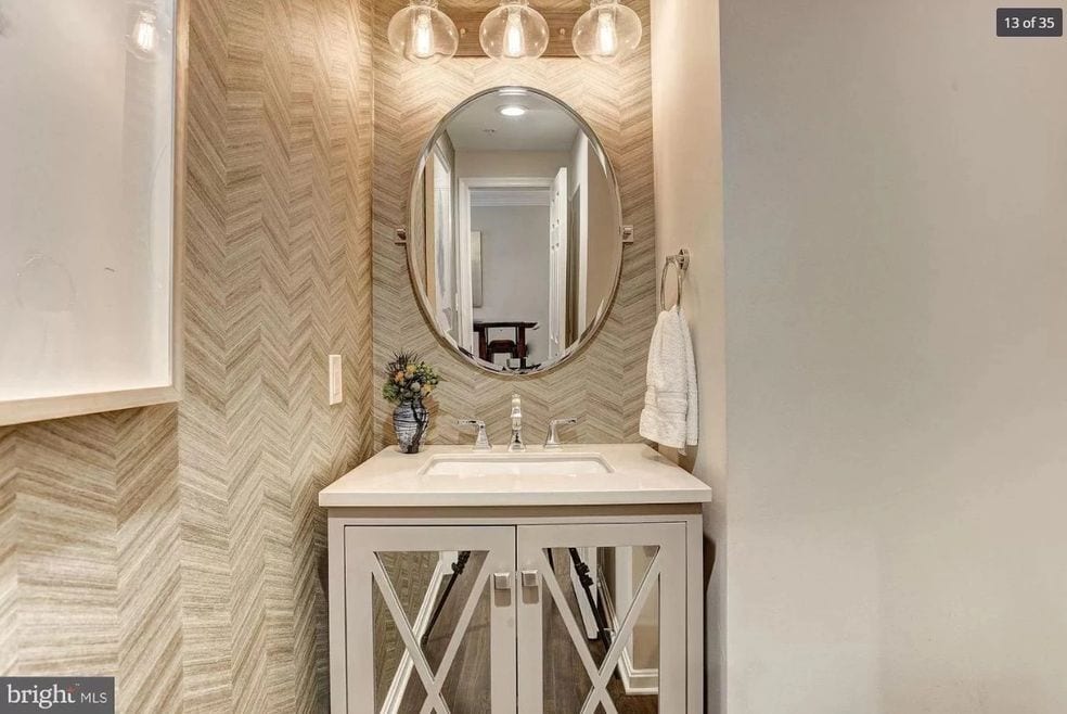 bathroom sink with oval mirror